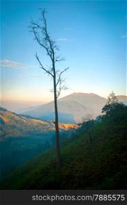 View over volcanic landscape of mountains at Kawah Ijen in morning dawn, Java, Indonesia