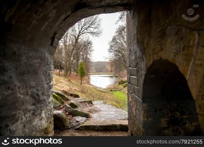 View through old tunnel on lake and park