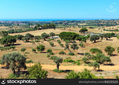 View to road, gardens and sea from famous ancient ruins in Valley of Temples, Agrigento, Sicily, Italy.