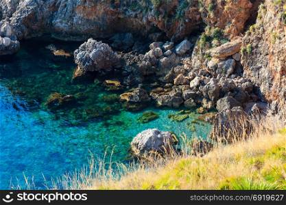 View to sea bay from coastline trail of Zingaro Nature Reserve Park, between San Vito lo Capo and Scopello, Trapani province, Sicily, Italy