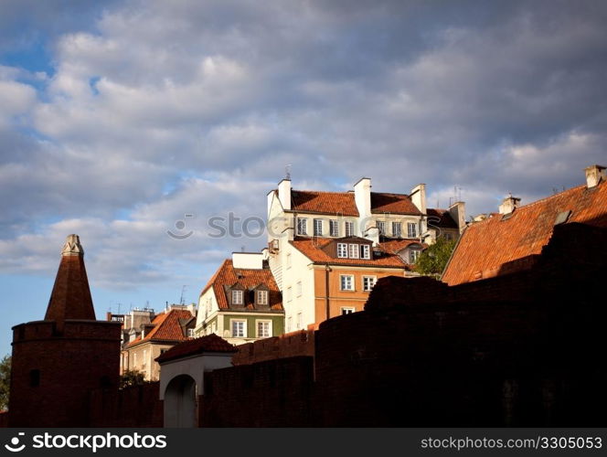 View towards the old town of Warsaw in Poland showing the multi colored houses and churches