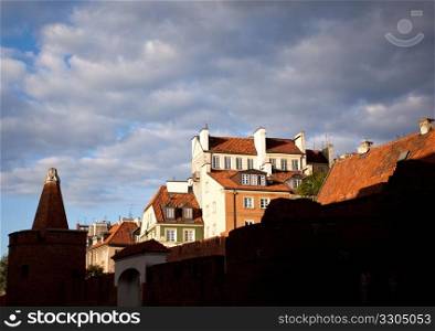 View towards the old town of Warsaw in Poland showing the multi colored houses and churches