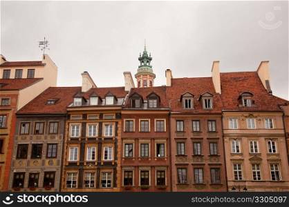 View towards the old town of Warsaw in Poland showing the multi colored houses and churches