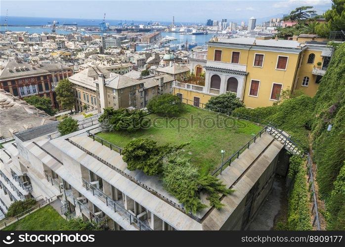 View with part of Genoa city and its famous, antique harbor, seen from the Spianata di Castelletto, Italy.