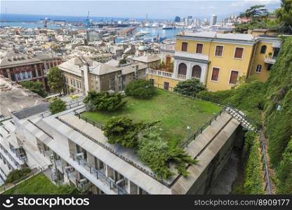 View with part of Genoa city and its famous, antique harbor, seen from the Spianata di Castelletto, Italy.