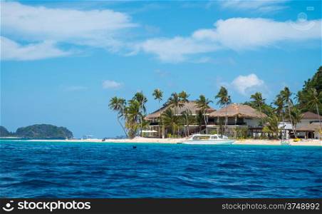 Villa on white sand tropical beach in Philippines