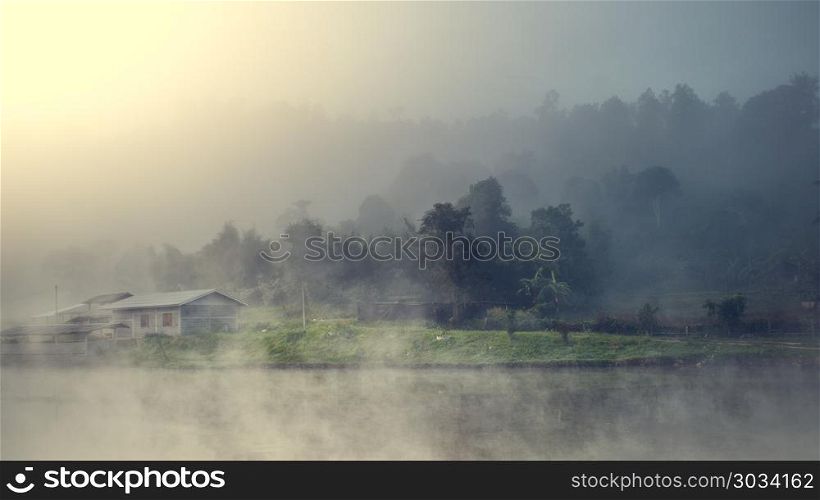 village among mountain and fog. Cottage in the village among mountain and fog