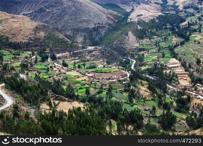 village and fields in a mountain valley
