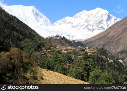 Village and snow mountain in Nepal