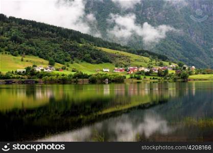 Village at waterfront, Granvinsvatnet, Granvin, Hordaland County, Norway