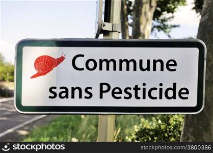 Village entry announcing the prohibition of use of pesticide for crops road sign.