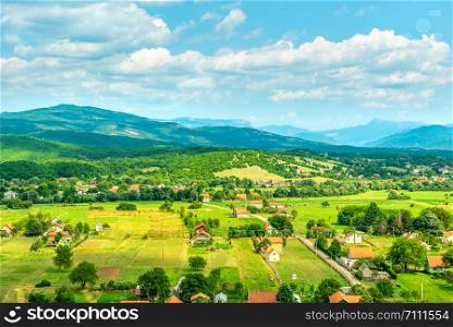 Village in the mountains of Montenegro at sunny summer day. Village in Montenegro