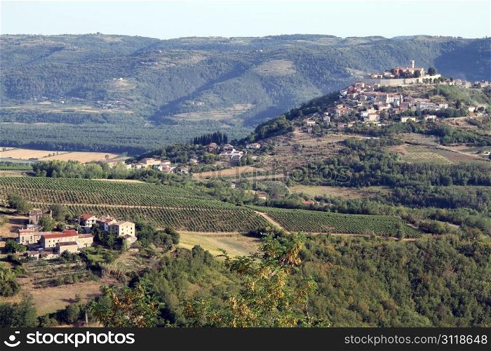 Village in valley and town Motovun on the hill, Istria, Croatia