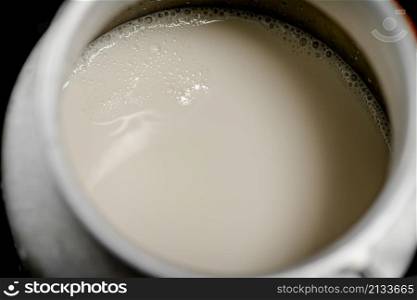 Village milk in a can. Macro background. High quality photo. Village milk in a can. Macro background.