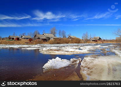 village on coast autumn river