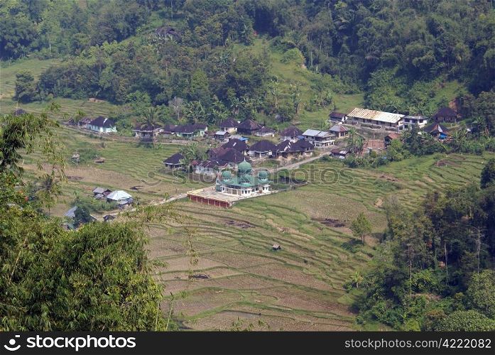 Village with mosque near mount in Sumatra, Indonesia