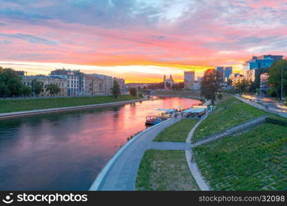 Vilnius. The river Vilia.. Scenic view of the embankment of the Neris River in Vilnius at sunset.