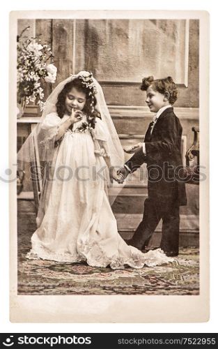 Vinatge photo portrait of little girl and boy in weding dressing. Retro picture original film grain and scratches