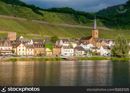 Vineyards above Moselle river and under dramatic sky near Alken, Germany