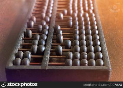 Vintage abacus on wooden background
