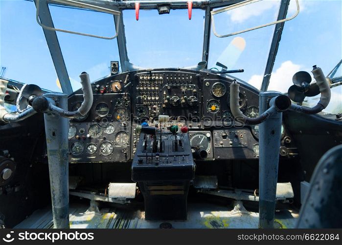 Vintage airplane dashboard, shallow focus on leverers. Vintage airplane dashboard