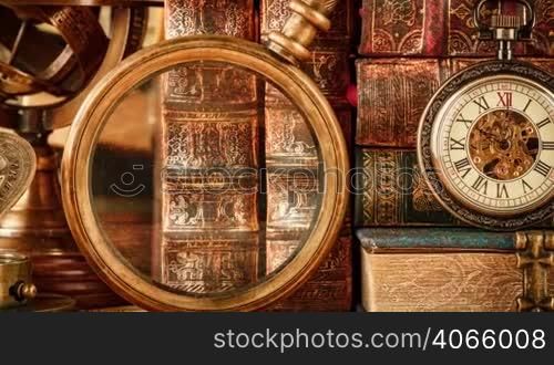 Vintage antique pocket watch against the background of old books