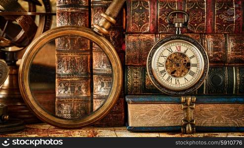 Vintage Antique pocket watch on the background of old books