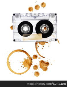 Vintage audio tape with coffee stains. Isolated on white background.