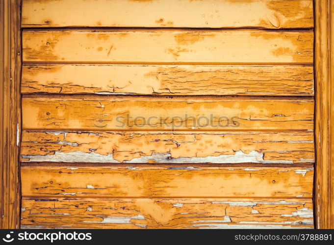 Vintage background from a wooden shabby plank. Toned image