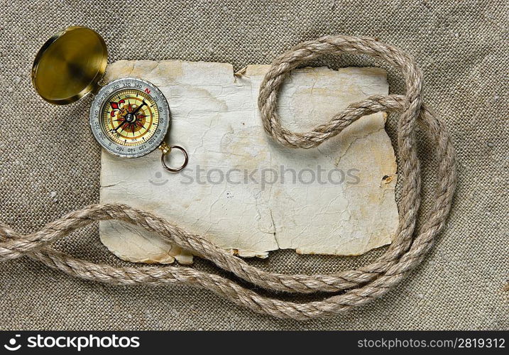 Vintage background with old paper and compass