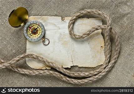 Vintage background with old paper and compass