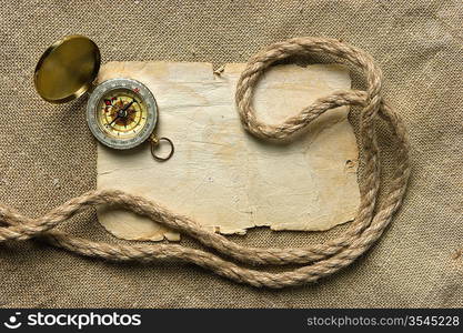 Vintage background with old paper and compass