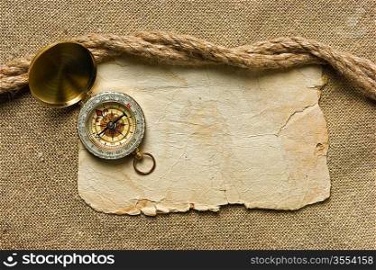 Vintage background with old paper and compass