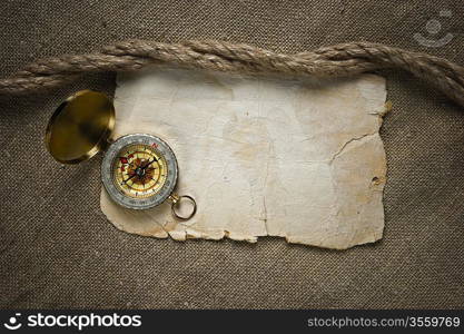 Vintage background with old paper and compass