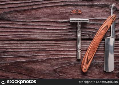 Vintage barber shop razor tools on wooden background. Vintage barber shop razor tools on old wooden background