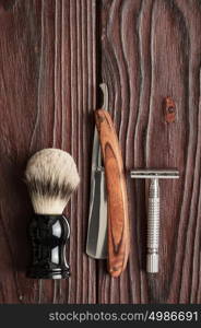 Vintage barber shop tools on old wooden background