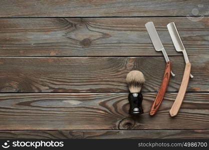 Vintage barber shop tools on old wooden background