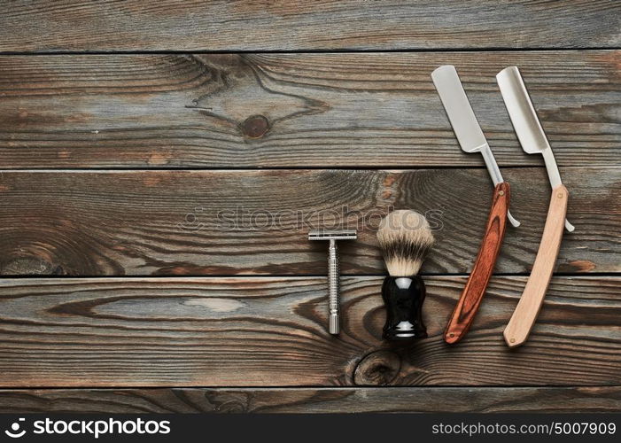 Vintage barber shop tools on old wooden background