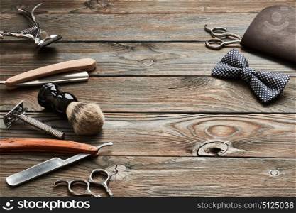 Vintage barber shop tools on old wooden background
