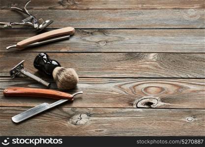Vintage barber shop tools on old wooden background
