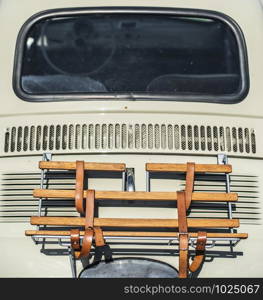 Vintage beige color car trunk. Small old car. Italian car. Sunny day