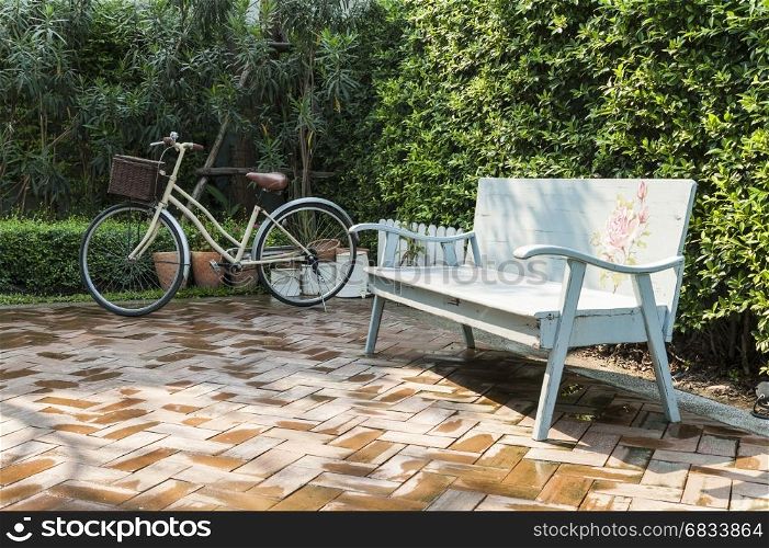 vintage bench and bicycle in garden