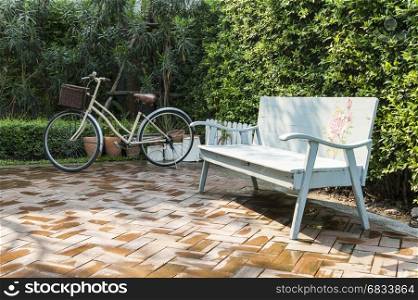 vintage bench and bicycle in garden
