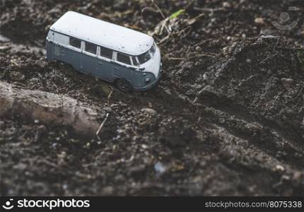 Vintage bus VW. Small metal toy in the nature. Miniature