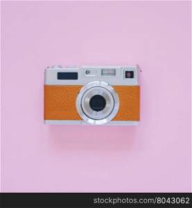 Vintage camera look on pink background, minimal style