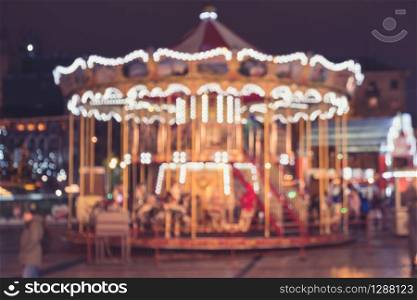 Vintage carrousel. Blurred merry-go-round. Abstract blurred holiday carousel background