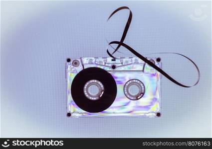 Vintage cassette tape on light blue background