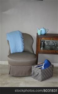 Vintage chair, decorated with light blue accessoiries
