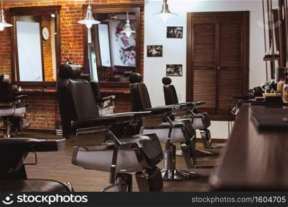 Vintage chairs and interior in stilish barbershop. Vintage chairs in barbershop