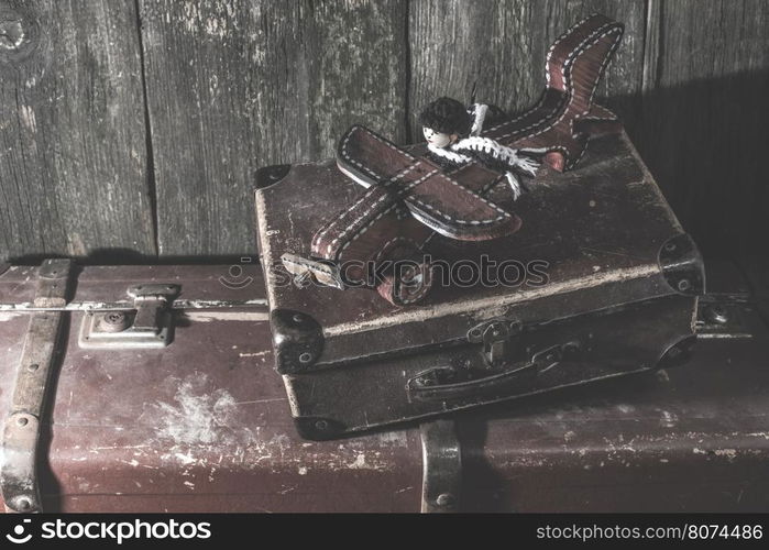 Vintage children's wooden toy airplane and manikin.